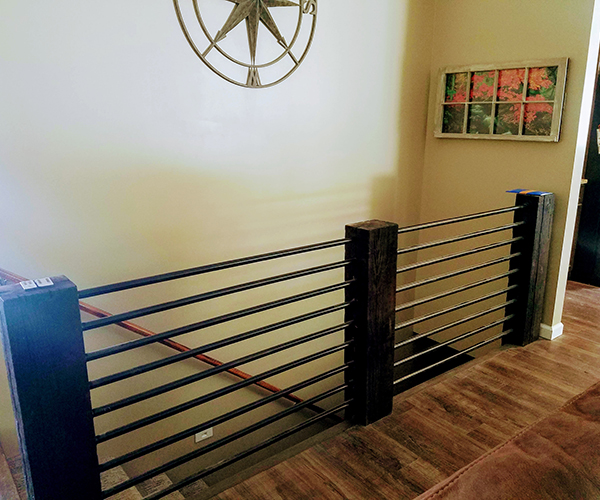 A staircase with metal railing