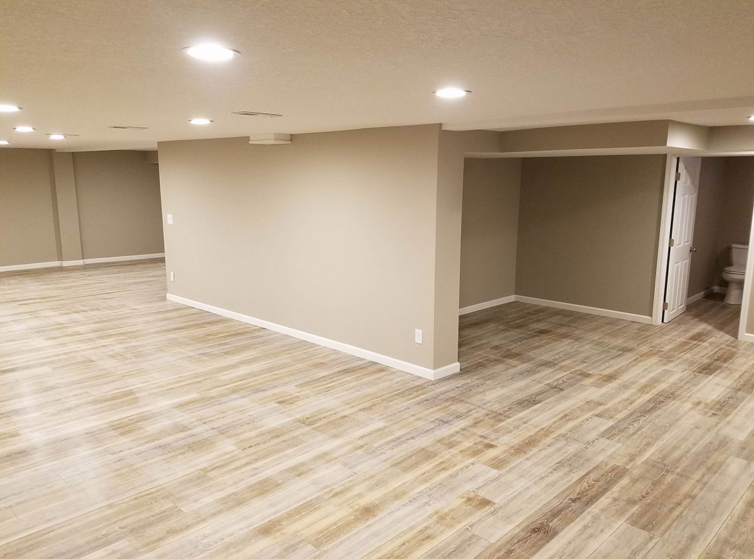 A room with hard wood floors and walls.