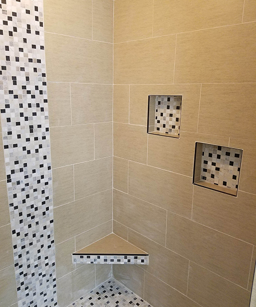 A bathroom with mosaic tiles