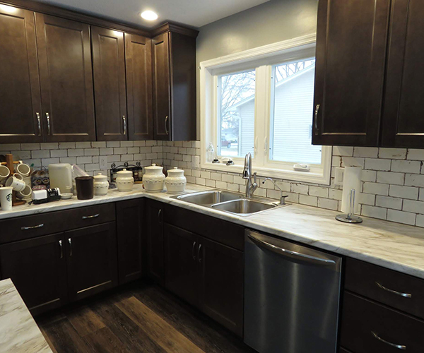 A kitchen counter with many jars