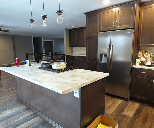 An island counter with kitchen tools