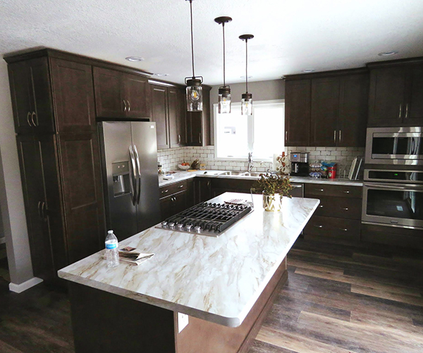 A marble island counter with a stove