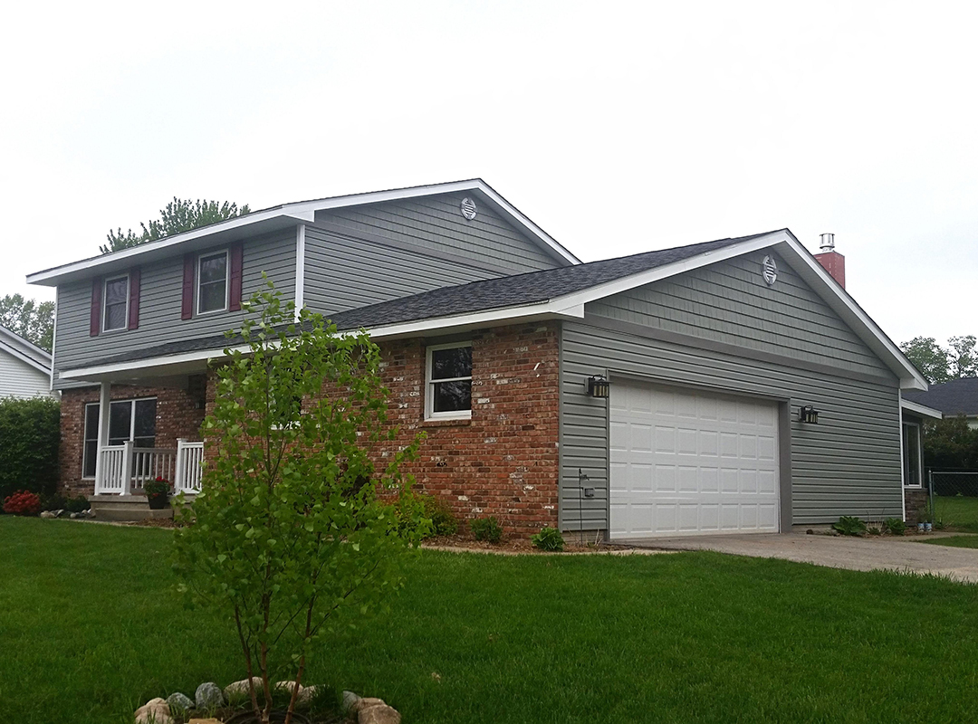 A two-story house with a yard