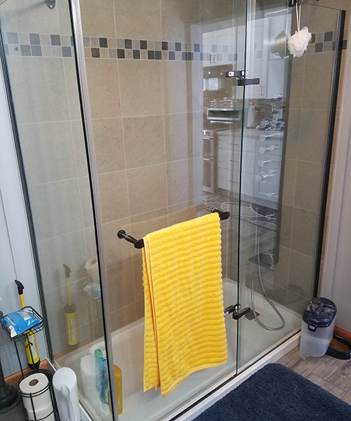 A bathroom with a towel hanger