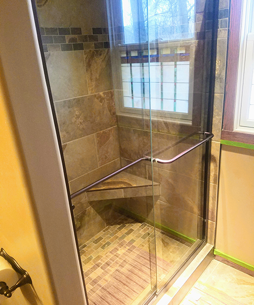 A shower with closed glass doors