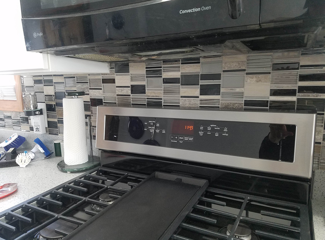 A tissue holder next to a stove