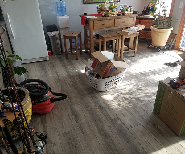 A living room with a basket on the floor