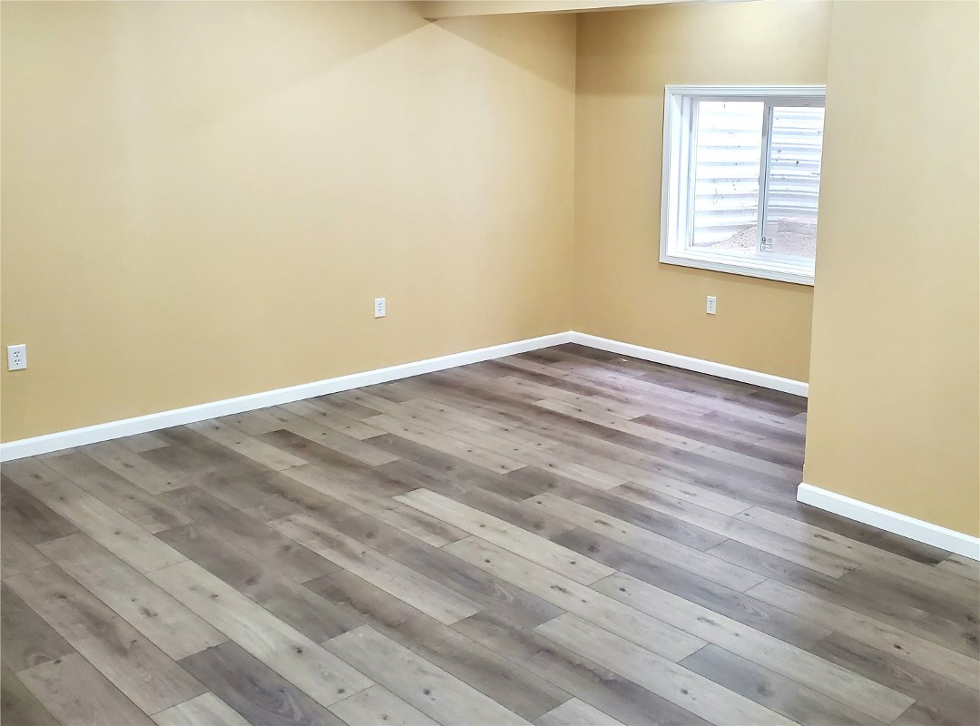 Basement Luxury Vinyl Plank Flooring and Trim Wilson Construction