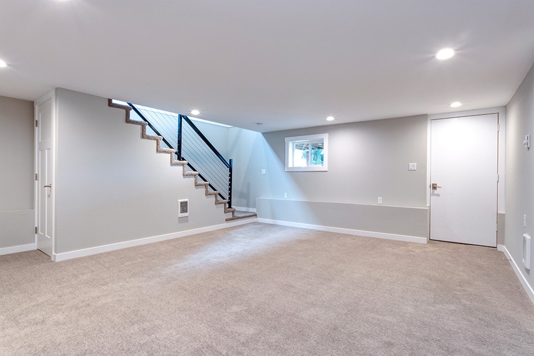 A room with stairs and a window in it