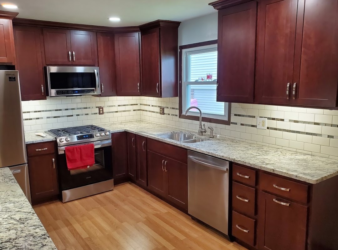 A kitchen with a tiled counter