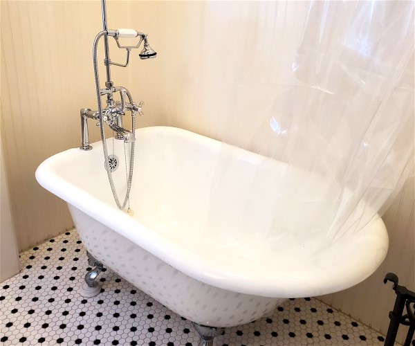 A long bathtub faucet