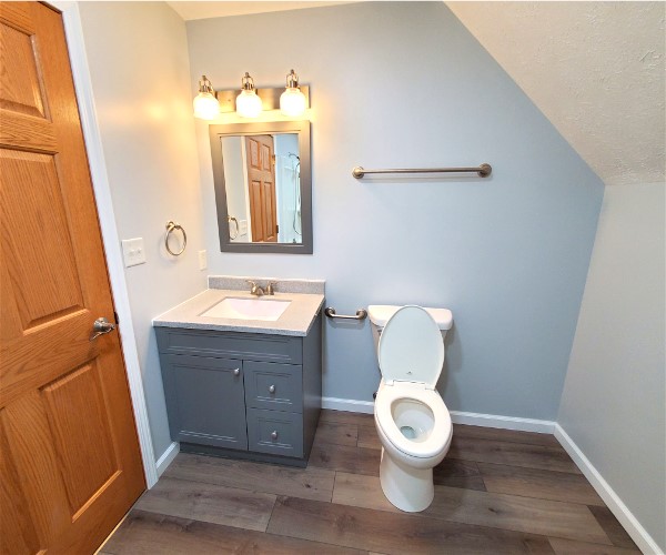 A bathroom with a toilet and sink in it