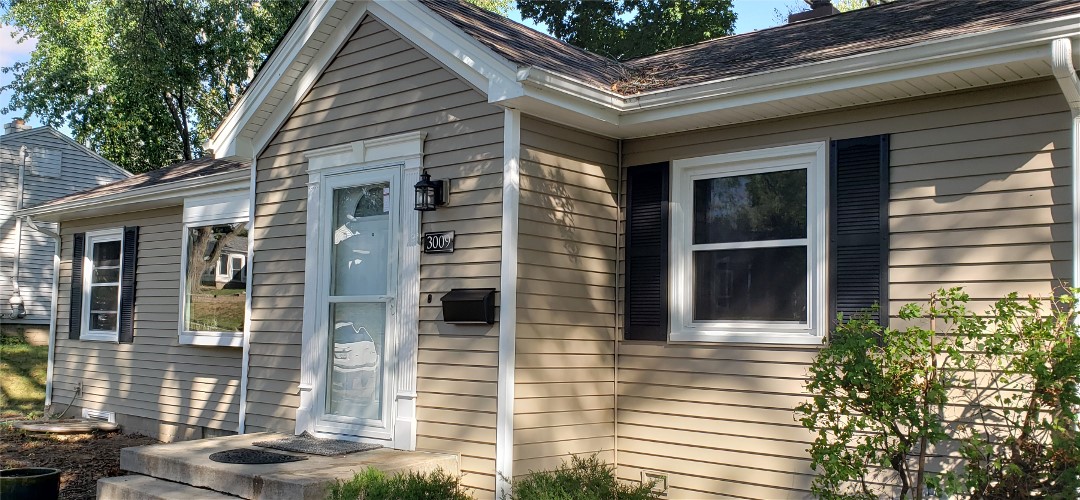 A house with a black door and white trim.