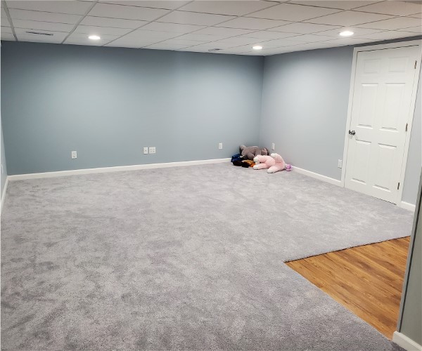 A woman laying on the floor in a room.