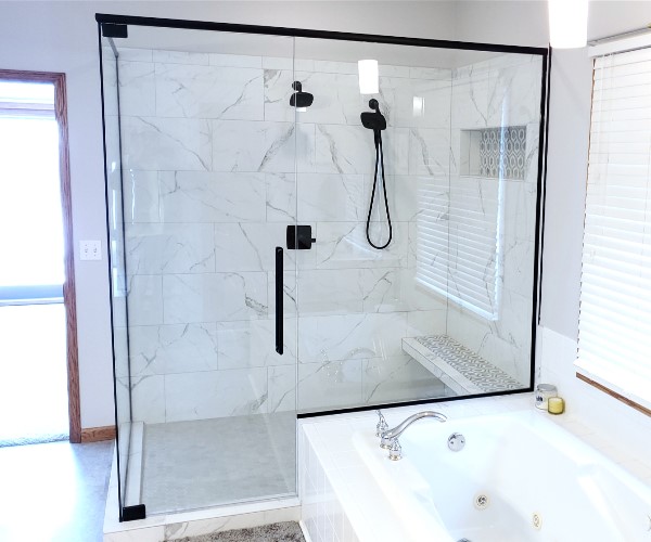 A bathroom with a shower and tub in it