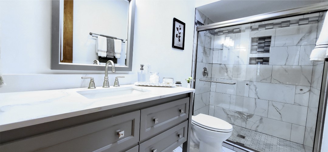 A bathroom with a toilet and sink in it