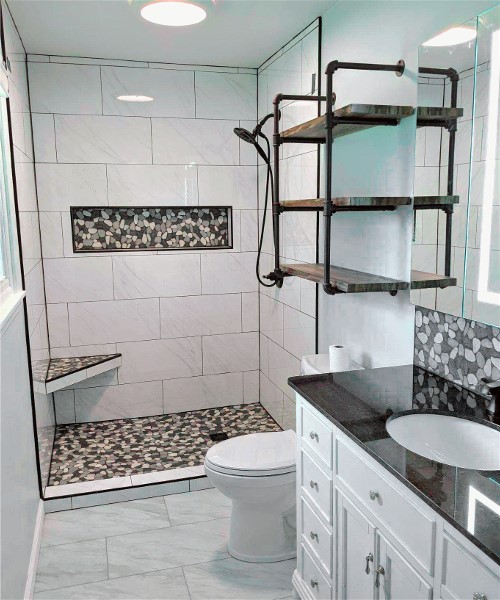 A bathroom with two sinks and tiled walls.