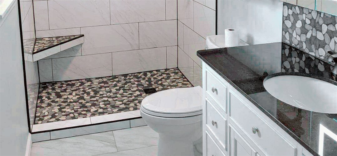 A clean bathroom with tiled flooring