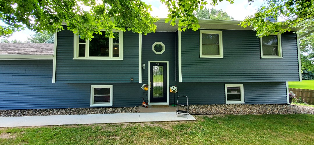 A house with a tree in front of it