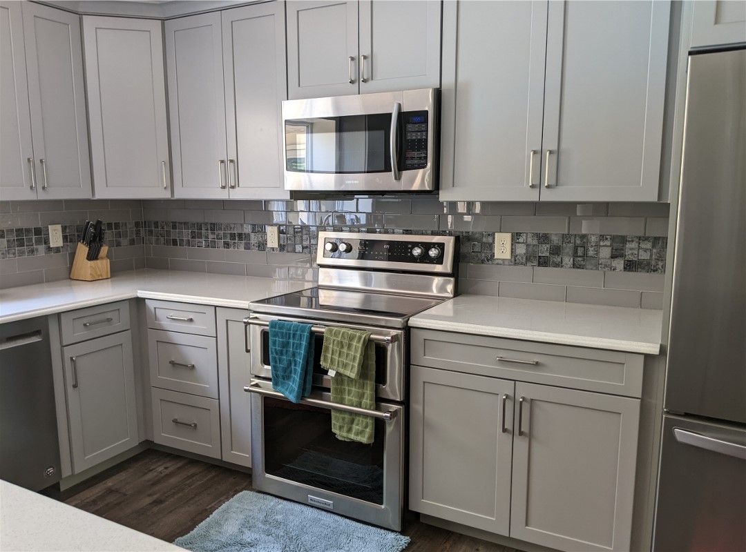 Hand towels in front of an oven