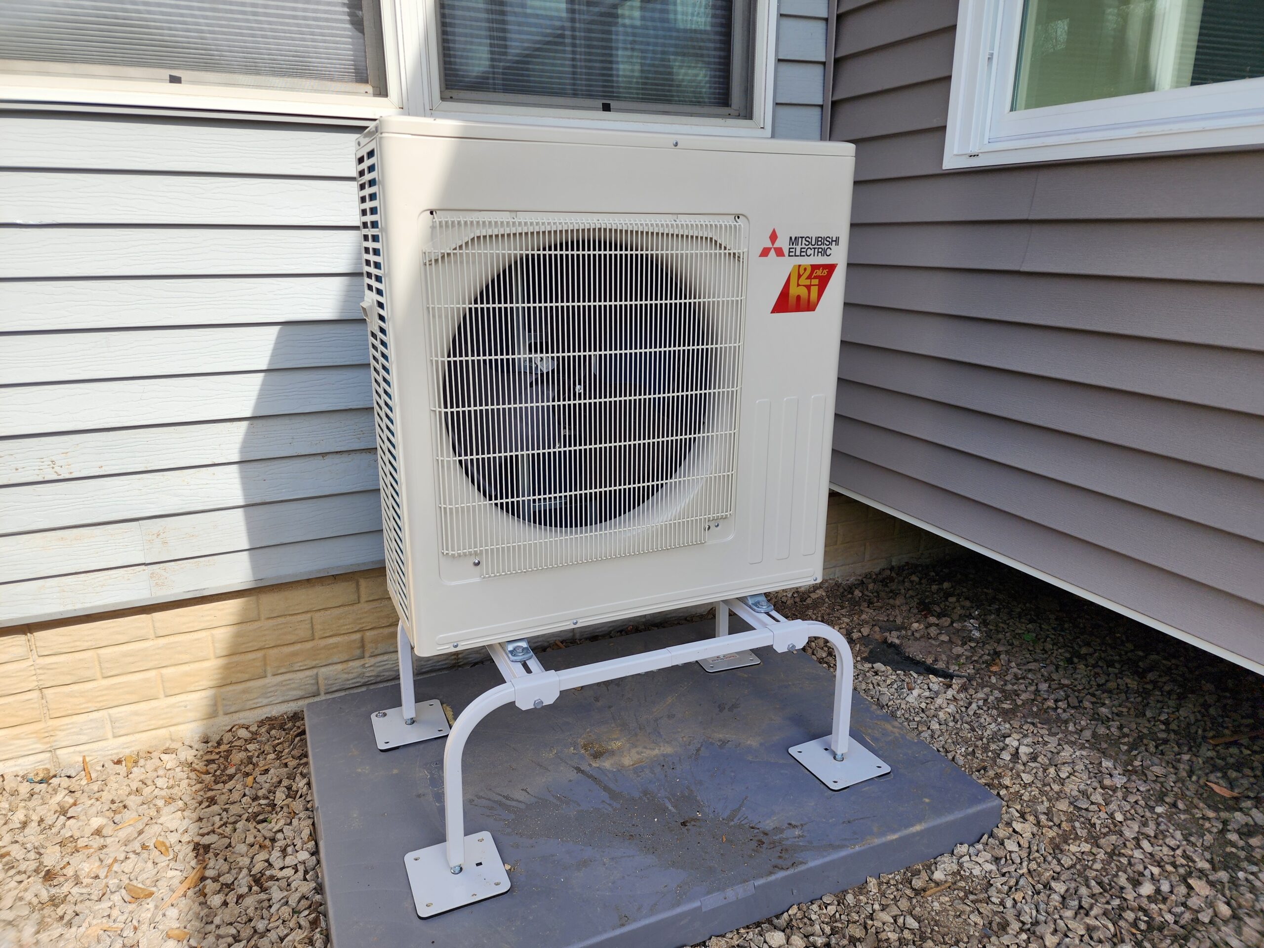 Four-season room addition with large windows in Port Byron IL by Ben Wilson Construction Services