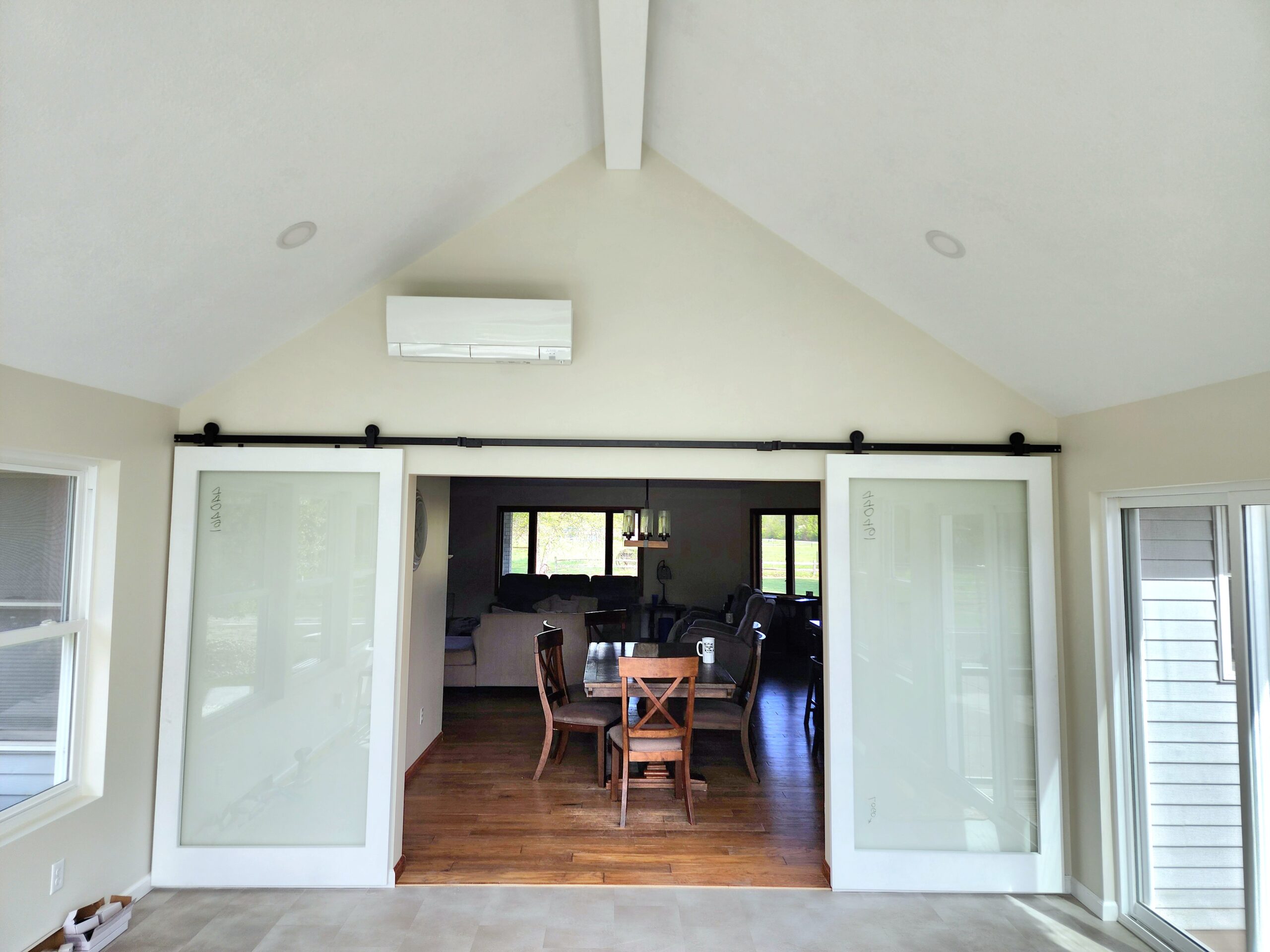 Four-season room addition with large windows in Port Byron IL by Ben Wilson Construction Services