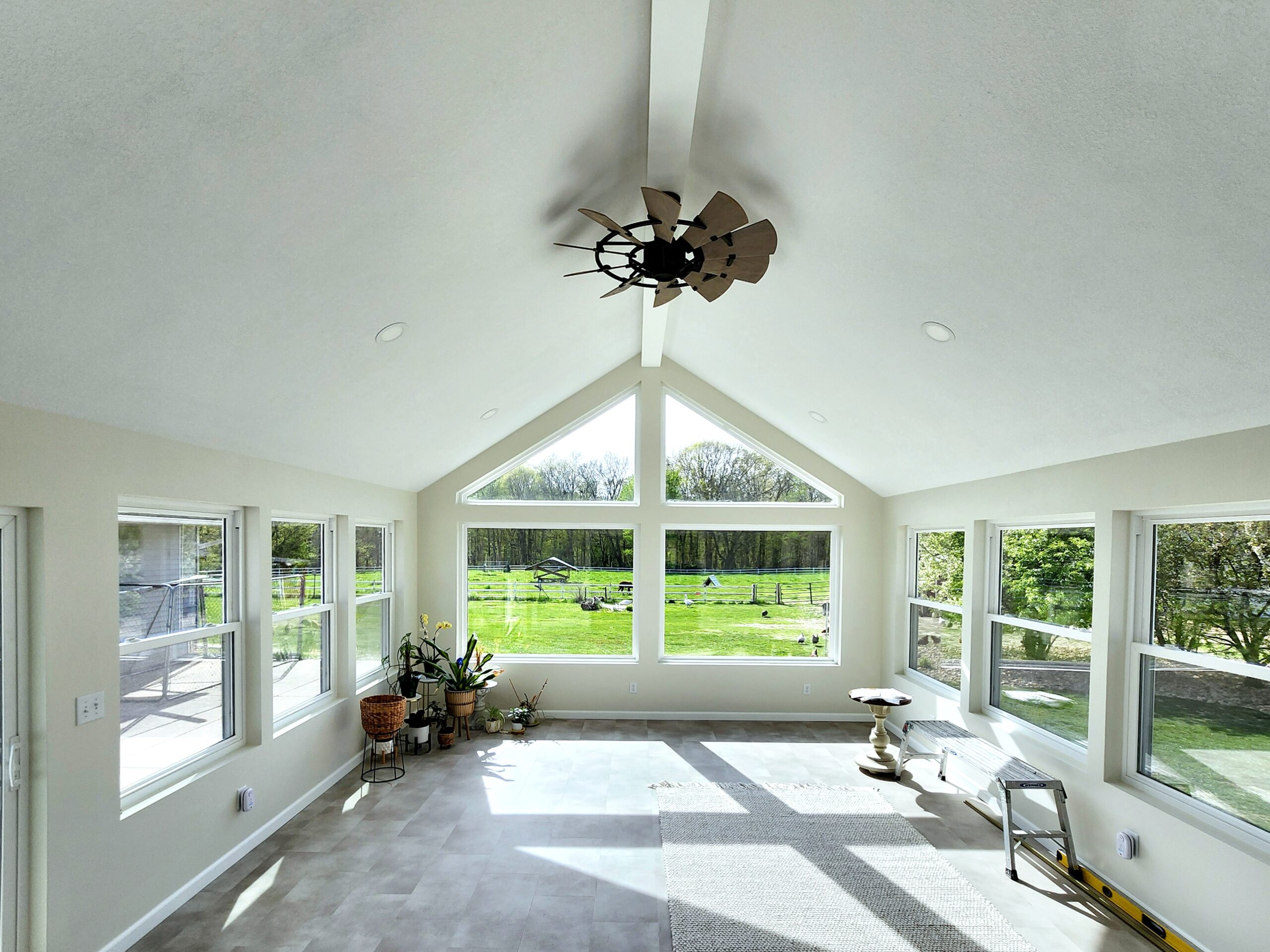 Four-season room addition with large windows in Port Byron IL by Ben Wilson Construction Services