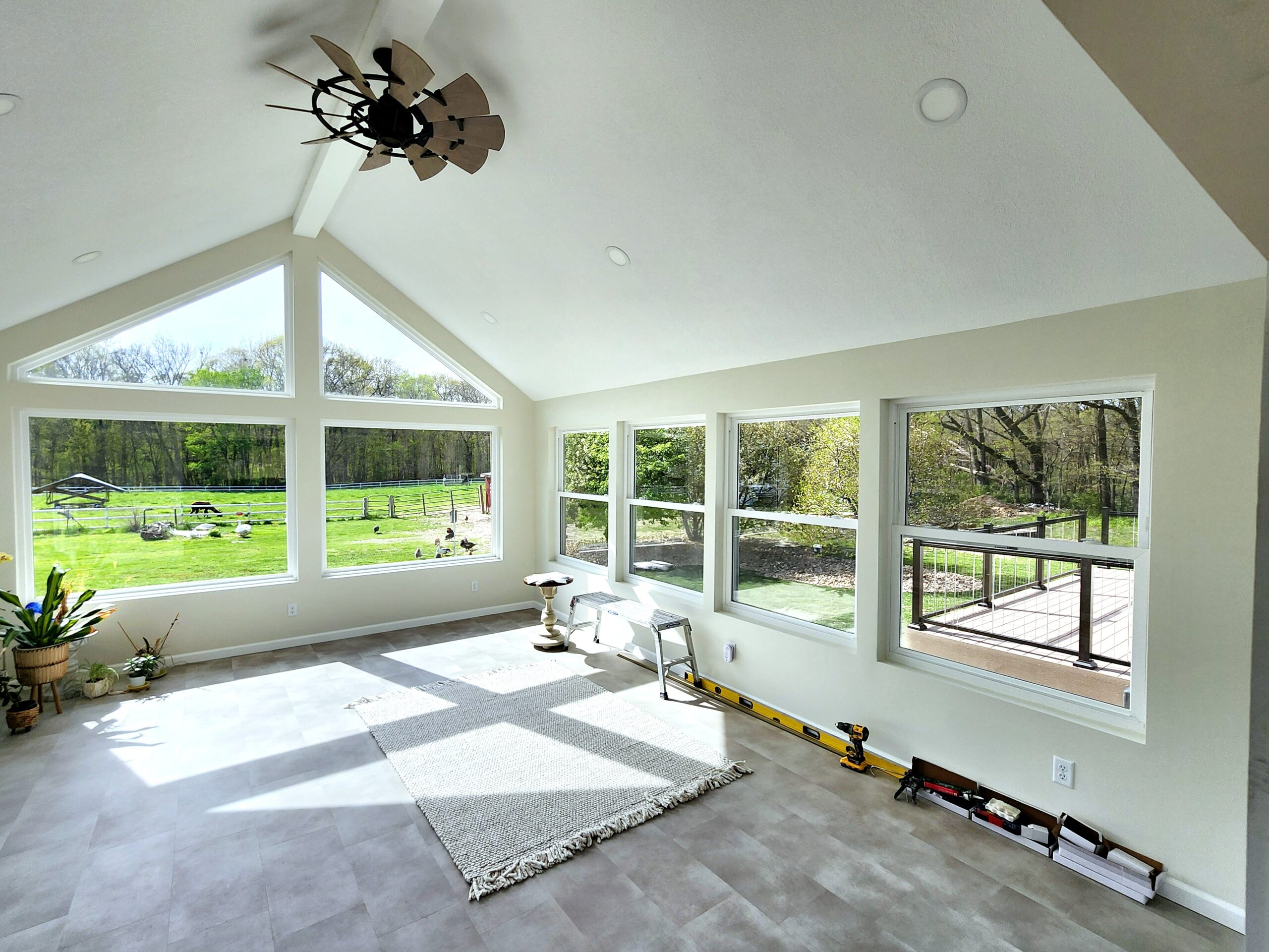 Four-season room addition with large windows in Port Byron IL by Ben Wilson Construction Services